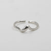 Silver ring on a light gray background