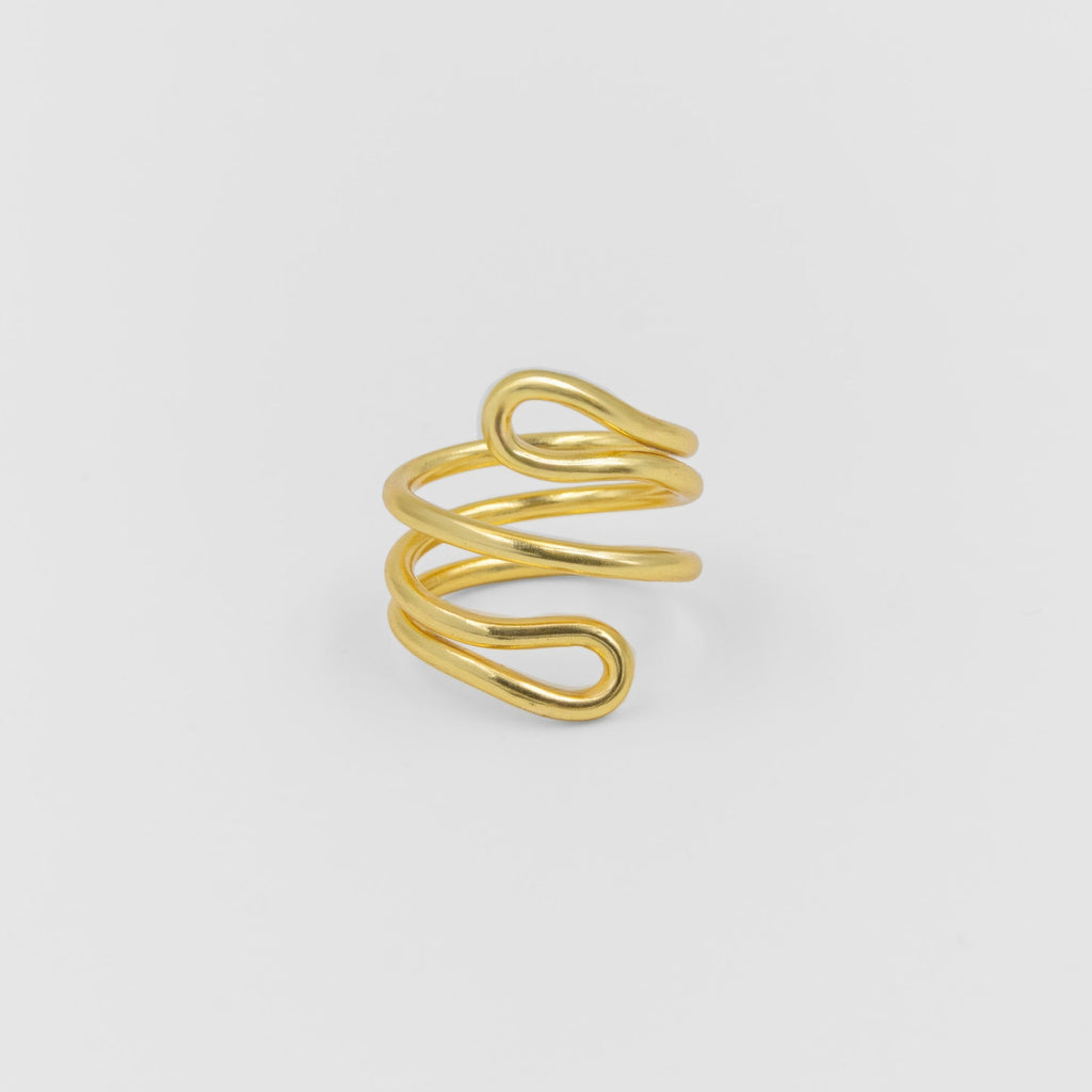 Gold spiral ring on a light gray background