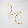 Gold anklet on a light gray background