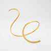 Gold anklet on a light gray background