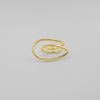 Gold spiral ring on a light gray background