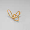 Gold open ring on a light gray background