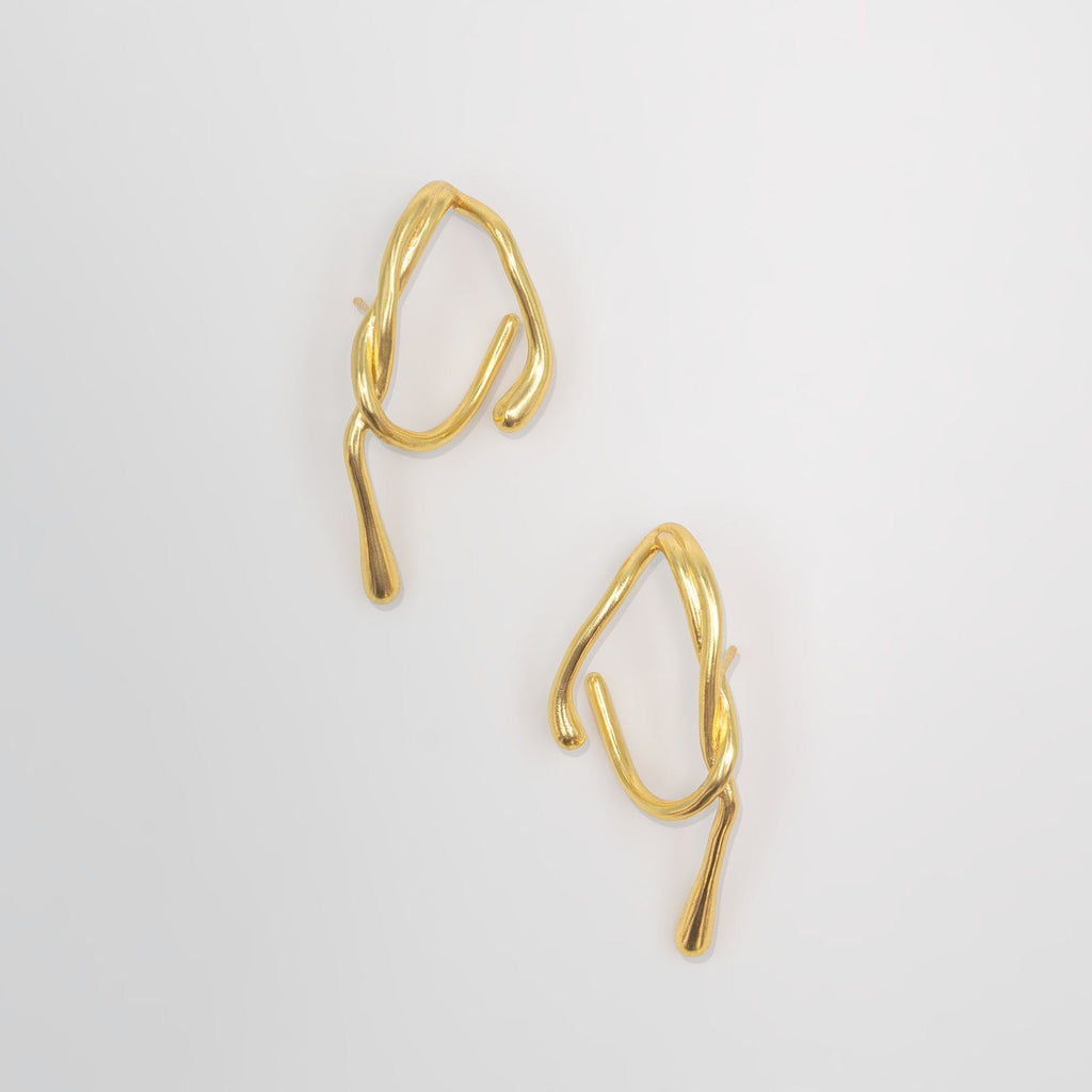 Gold hoop earrings on a white background