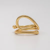 Gold spiral ring on a light gray background