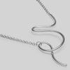 Silver necklace with a unique design on a light gray background