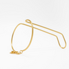 Gold hand cuff on a white background