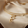 Gold necklace on a white background