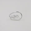 Silver ring on a light gray background
