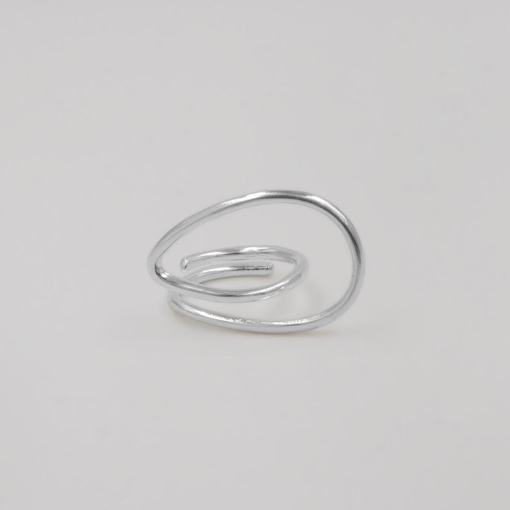 Silver ring on a light gray background